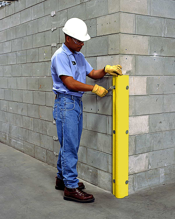 Guy Installing A Corner Protector For Wall
