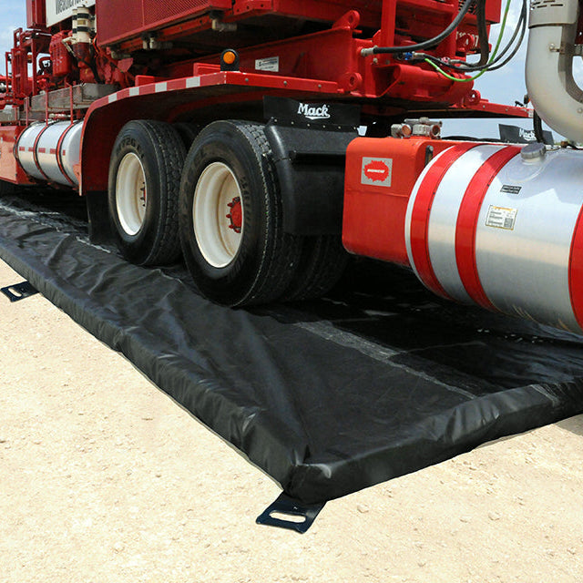 Truck parked inside an UltraTech foam wall spill containment berm
